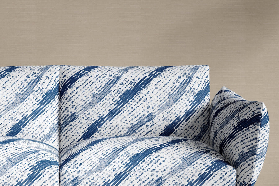 sofa upholstered in 100% linen glissando shibori fabric in marine blue
