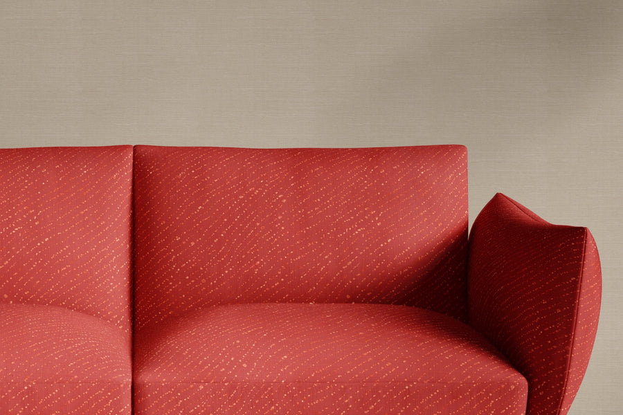 sofa upholstered in 100% linen staccato decolorato shibori fabric in paprika red
