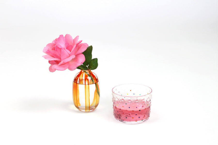tangerine hand-painted bud vase with pink rose and hand-painted hand-blown confetti glass with rose