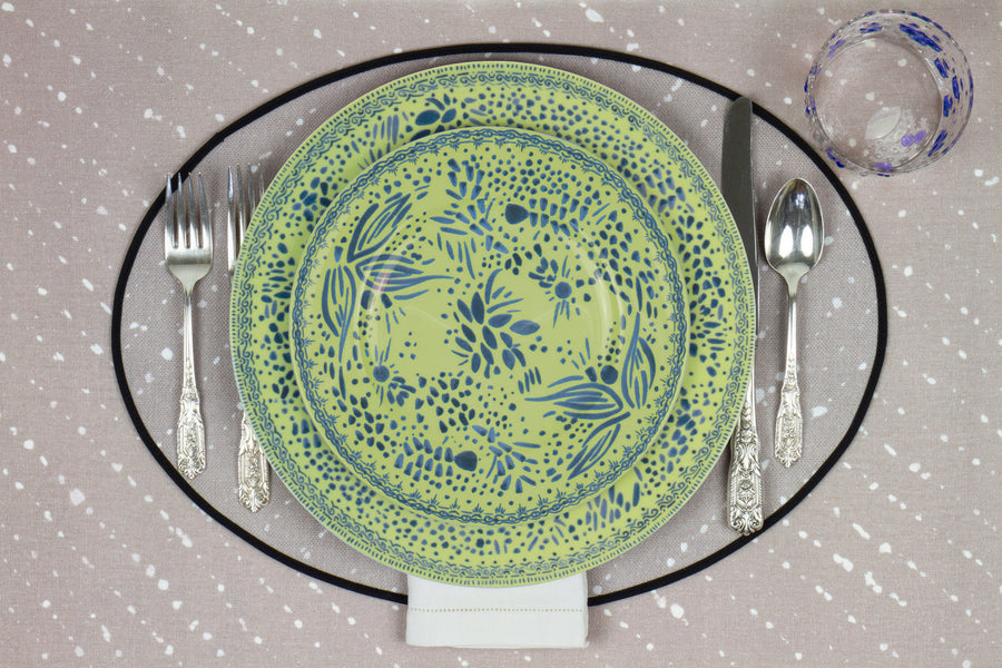 Venable Moore Mosaic Garden stacked dinner and salad/dessert plate in fresh apple green with hand-painted Bubble glass on neutral flax tan 'Staccato Sbiancato' Shibori linen placemat and tablecloth with silverware and white linen napkin