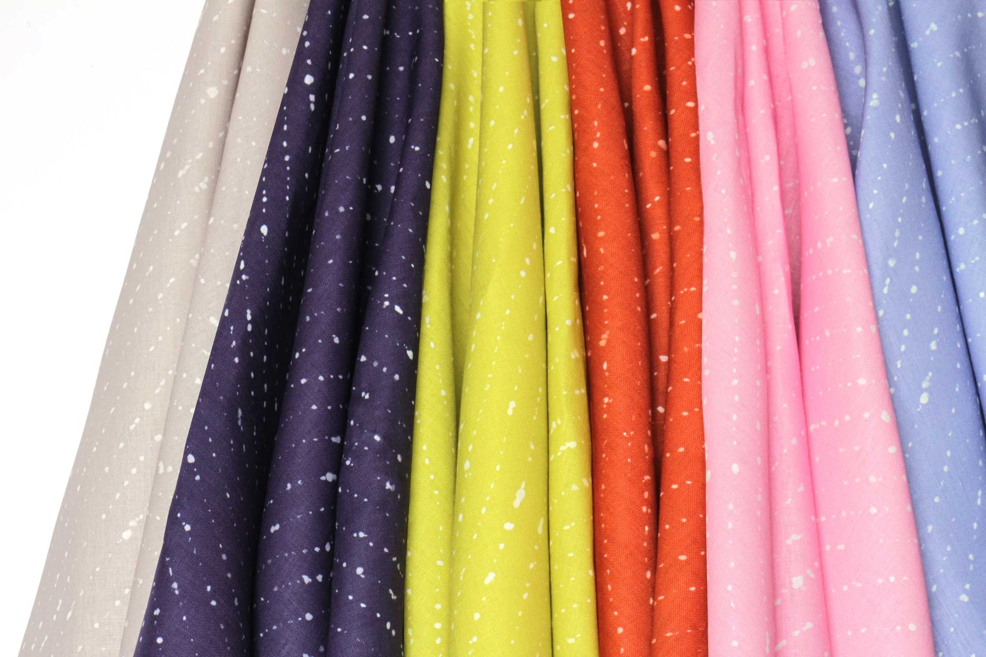 'Staccato Sbiancato' made to order 100% European Shibori linen hanging in flax tan, sapphire blue, pear green, ginger orange, carnation pink, and cornflower blue