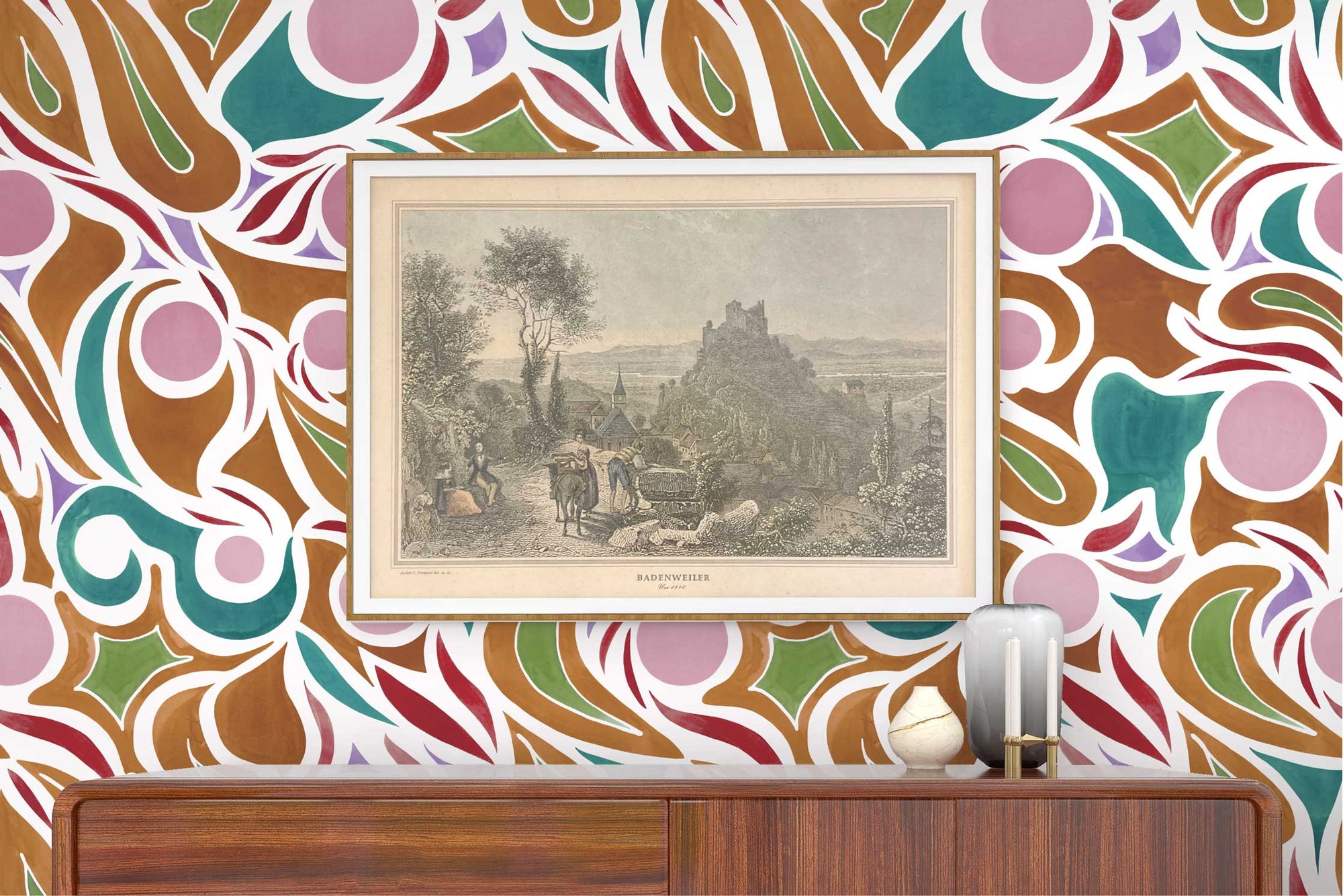 Venable Moore ‘Capri’ Damson Plum Purple, Brown, and Teal made-to-order, printed in the U.S.A. wallpaper on a wall with wood console, vases, and framed art