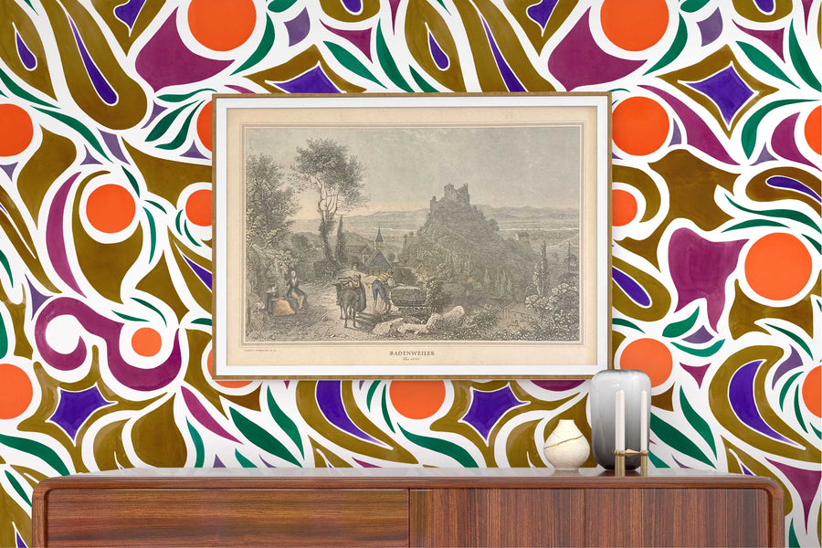 Venable Moore ‘Capri’ Orange, Brown, and Purple made-to-order, printed in the U.S.A. wallpaper on a wall with wood console, vases, and framed art