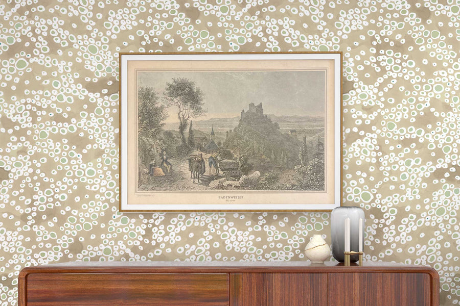 Venable Moore ‘Frizzante’ neutral buff tan made-to-order, printed in the U.S.A. wallpaper on a wall with wood console, vases, and framed art