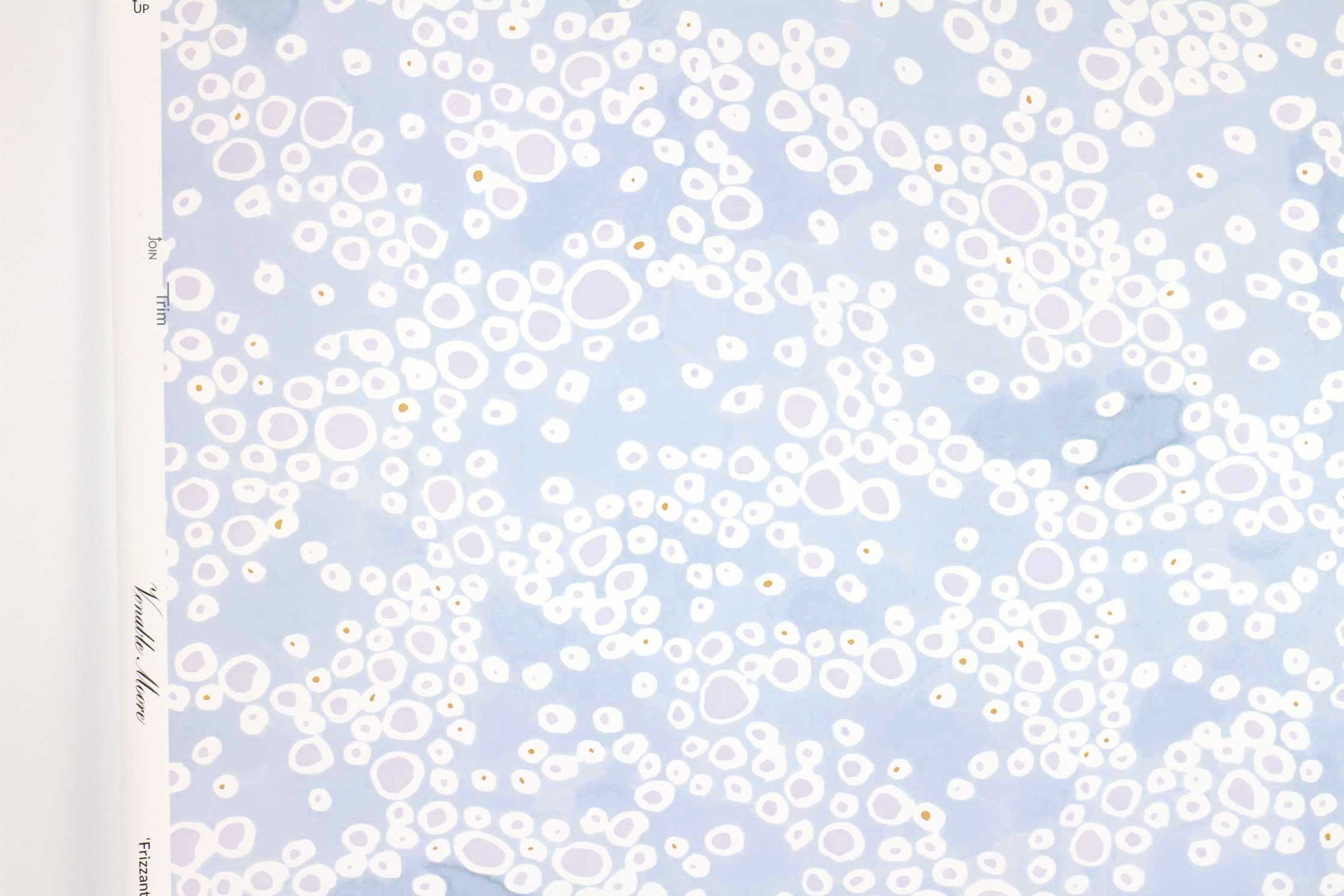 Up close view of Venable Moore ‘Frizzante’ Pastel Ice blue FSC Certified Clay Coated wallpaper roll against a white wall