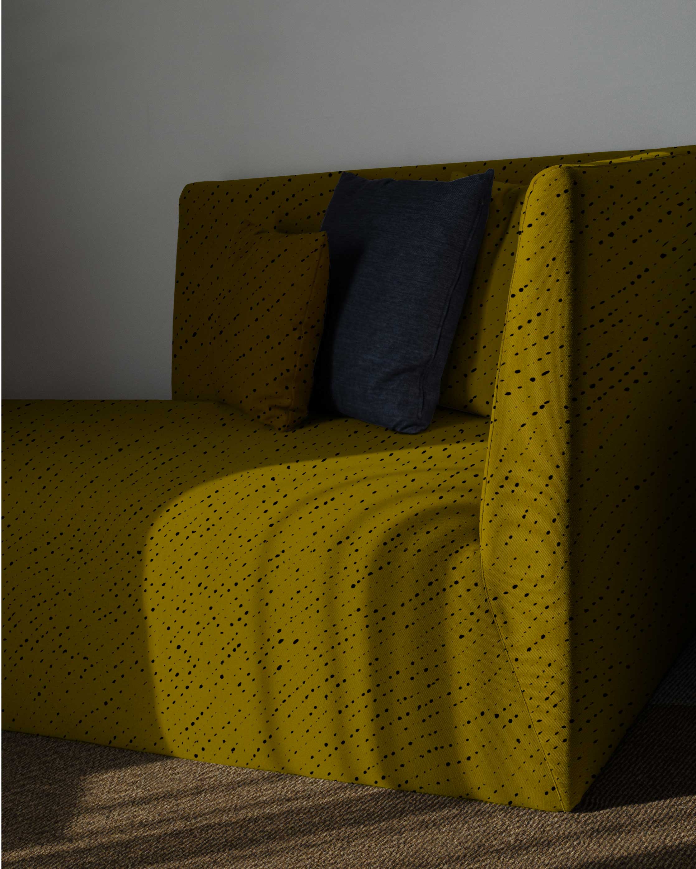 Venable Moore made to order Staccato Nero Shibori linen in moss on sofa with pillows in sunlight in cozy room