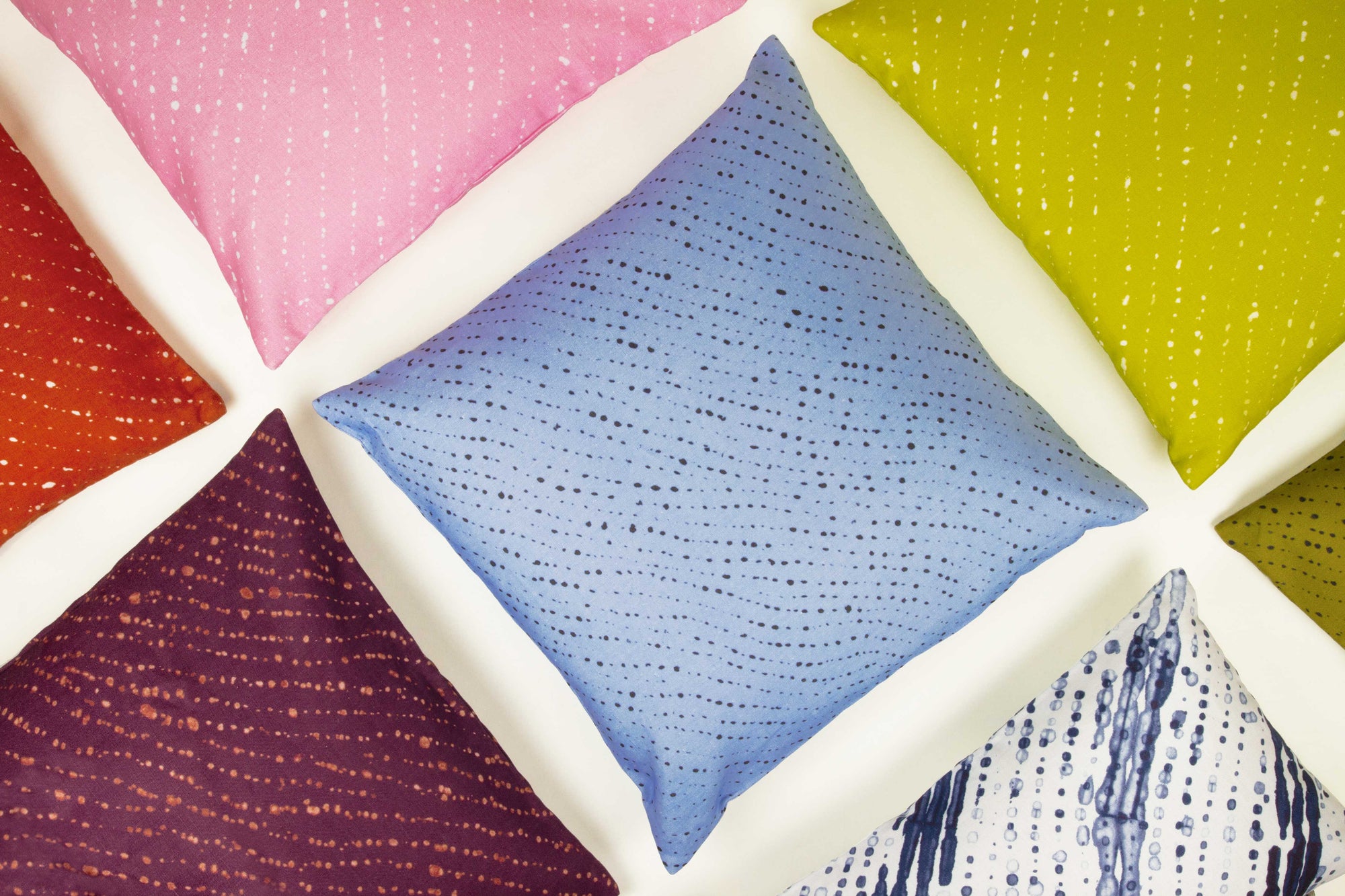Venable Moore 100% European linen made to order Shibori linen pillow covers in plum purple, sky blue, pear green, marine blue, carnation pink, and ginger orange