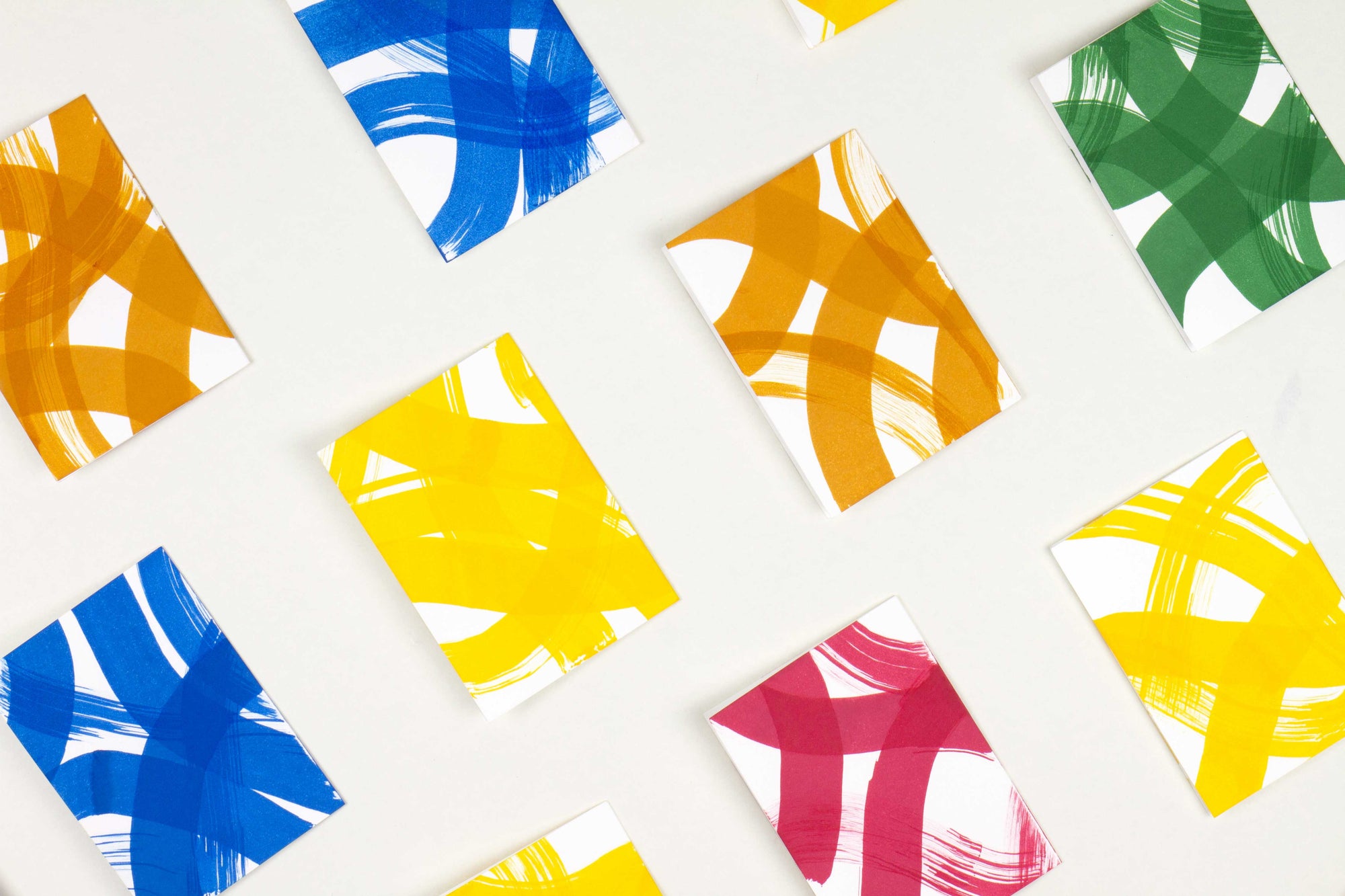 Venable Moore hand-painted and one-of-a-kind stripes and squiggles cards in crimson red, pine green, ochre tan, goldenrod yellow, and cobalt blue