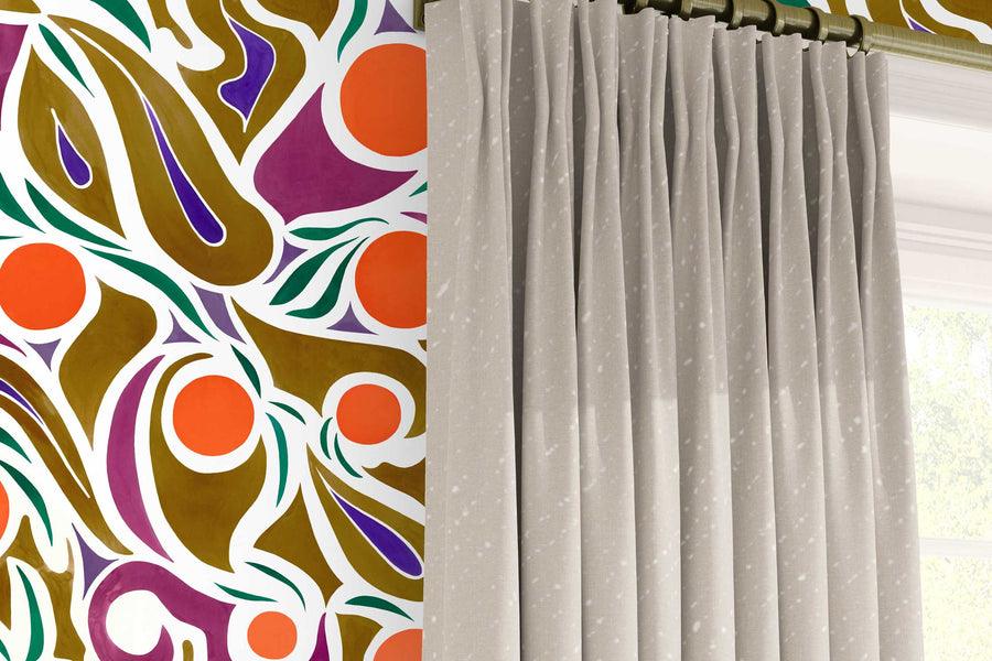 Venable Moore ‘Capri’ Orange, Brown, and Purple made-to-order, printed in the U.S.A. wallpaper on a wall with 100% European linen “Staccato Sbiancato’ Shibori curtains in flax natural and window 