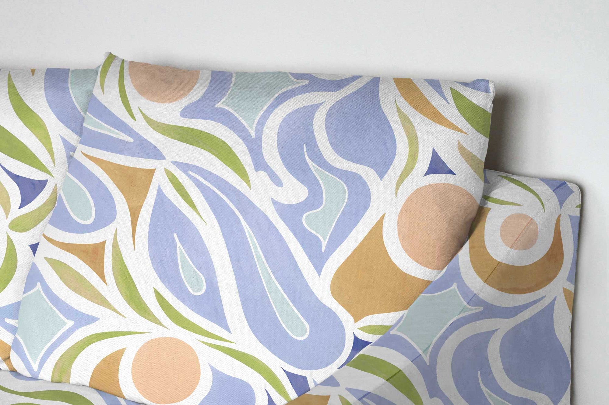 Venable Moore Capri floral linen in peach upholstered on a sofa 