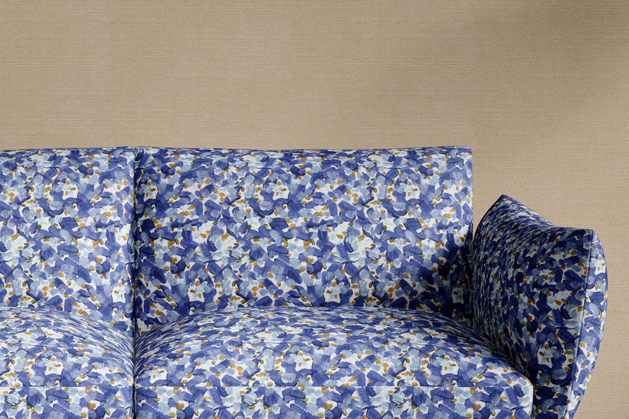 sofa upholstered in 100% cotton Venable Moore Chintz Moderne abstract floral in azure blue, orange, and white fabric made-to-order and sustainably printed in the U.S.A.