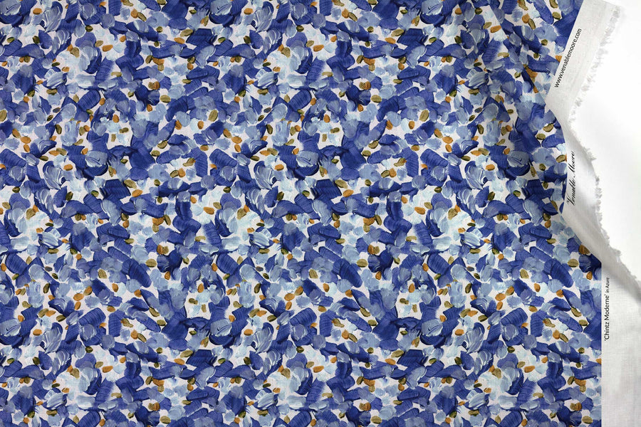 Venable Moore 100% Cotton Chintz Moderne abstract floral fabric by the yard in azure blue, orange, and white with top fold against white