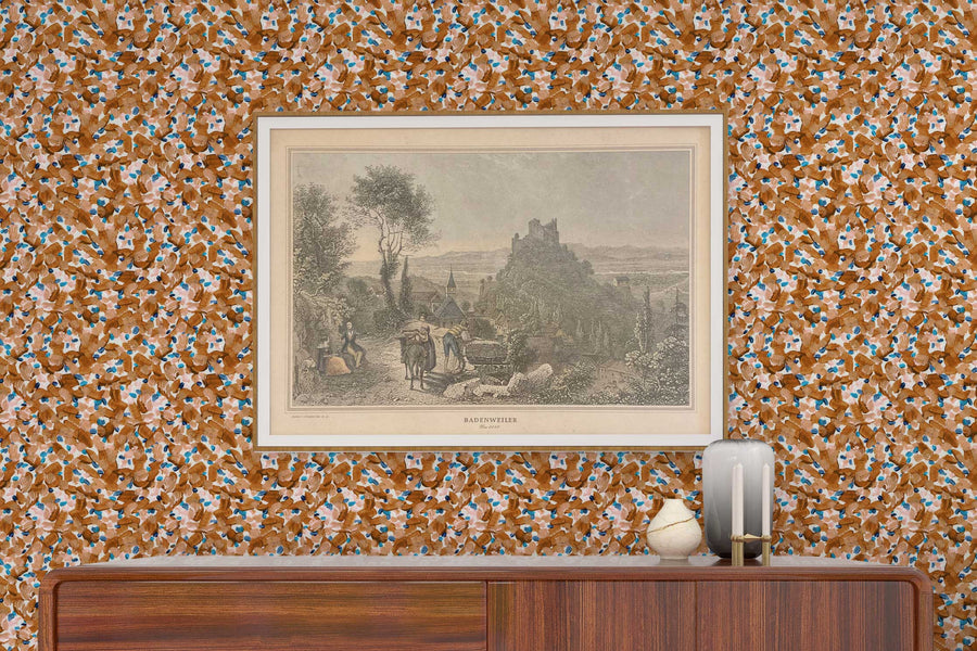 Venable Moore Chintz Modern floral abstract in apricot orange, pink , and blue made-to-order, printed in the U.S.A. wallpaper on a wall with wood console, vases, and framed art