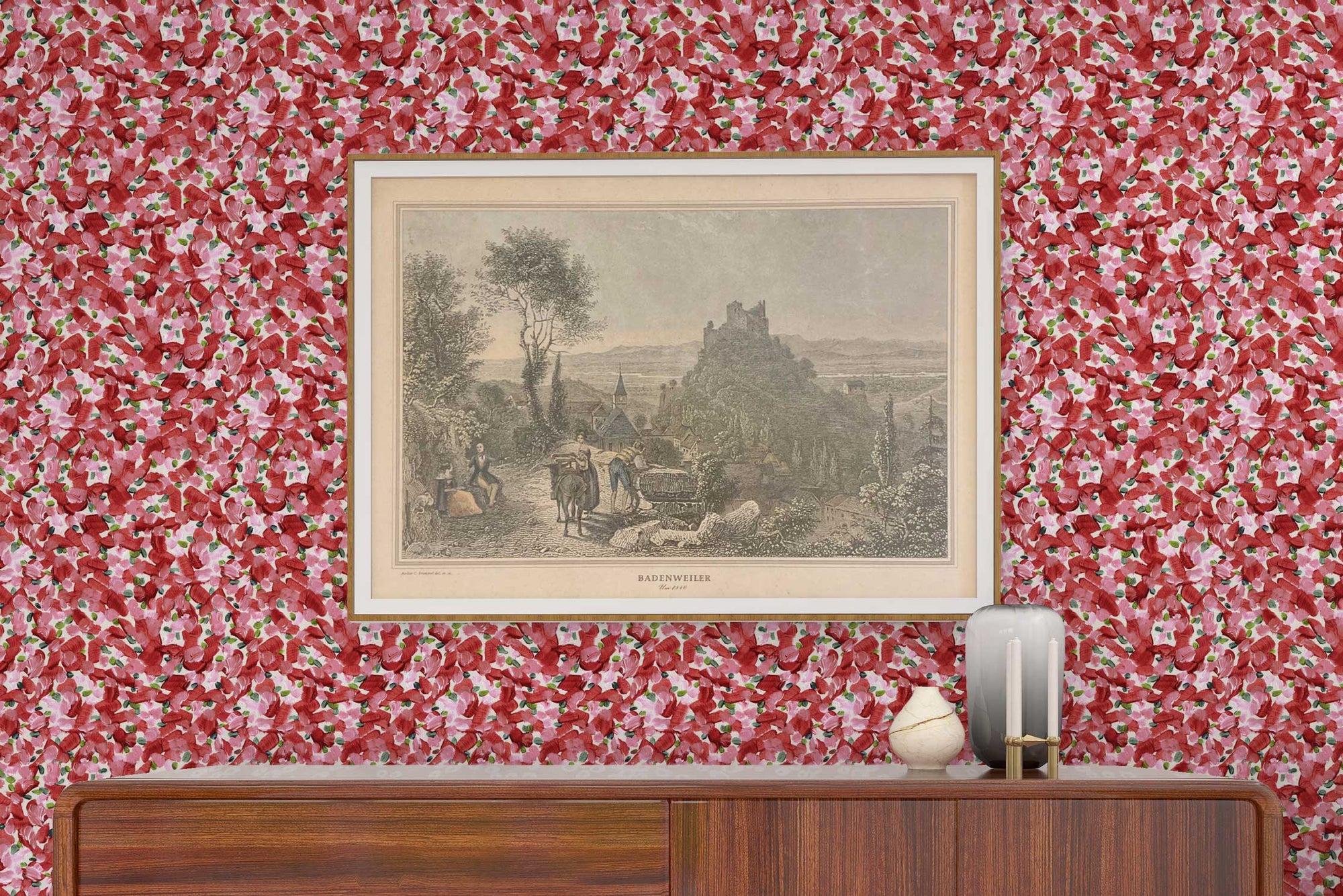 Venable Moore Chintz Modern floral abstract in cherry red, pink, and green made-to-order, printed in the U.S.A. wallpaper on a wall with wood console, vases, and framed art