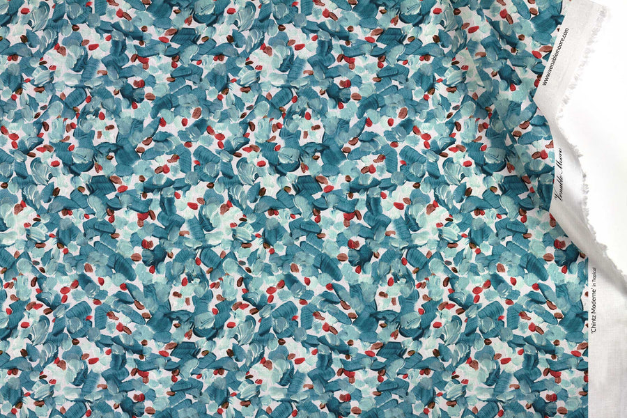 Venable Moore 100% Cotton Chintz Moderne abstract floral fabric by the yard in tropical turquoise blue, red, and white with top fold against white