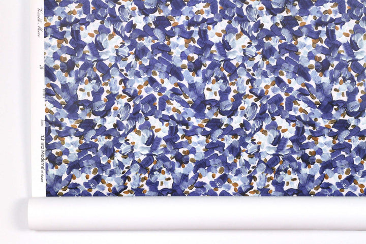 Venable Moore Chintz Modern floral abstract in azure blue, orange, and white boutique made-to-order, printed in the U.S.A. wallpaper roll against white wall