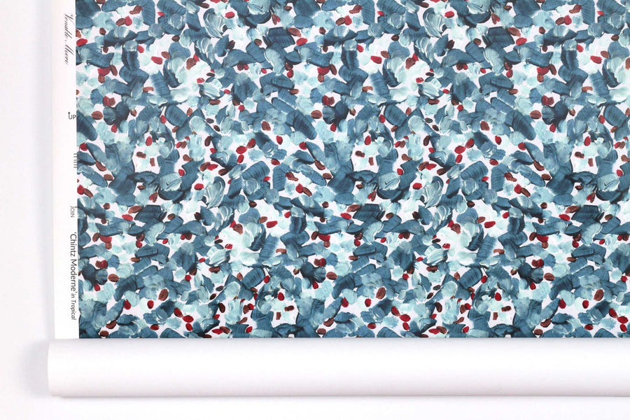 Venable Moore Chintz Modern floral abstract in turquoise blue, red, and white boutique made-to-order, printed in the U.S.A. wallpaper roll against white wall