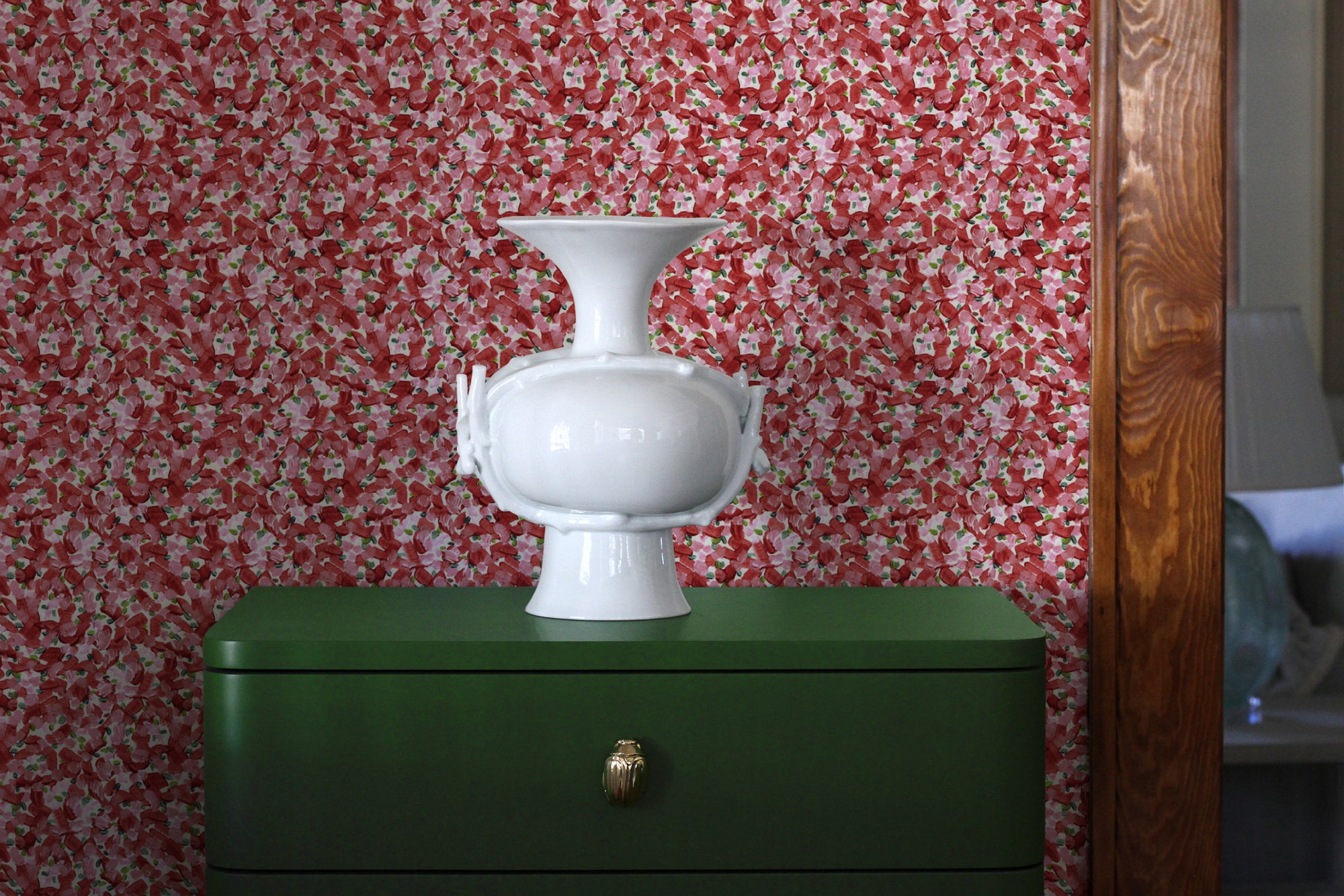 Chintz Moderne hand-painted floral wallpaper in cherry installed in a living room
