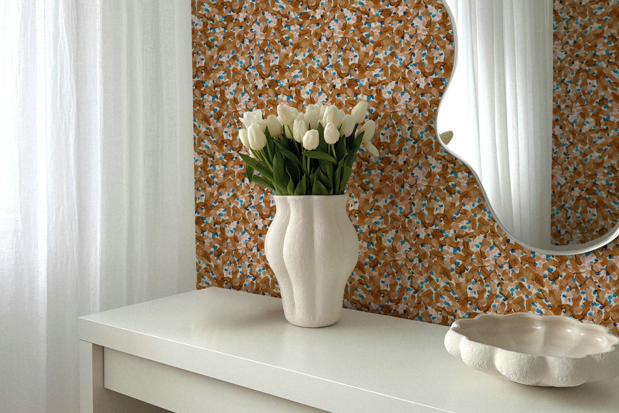 Chintz Moderne floral wallpaper in apricot installed in a bedroom with vase of flowers