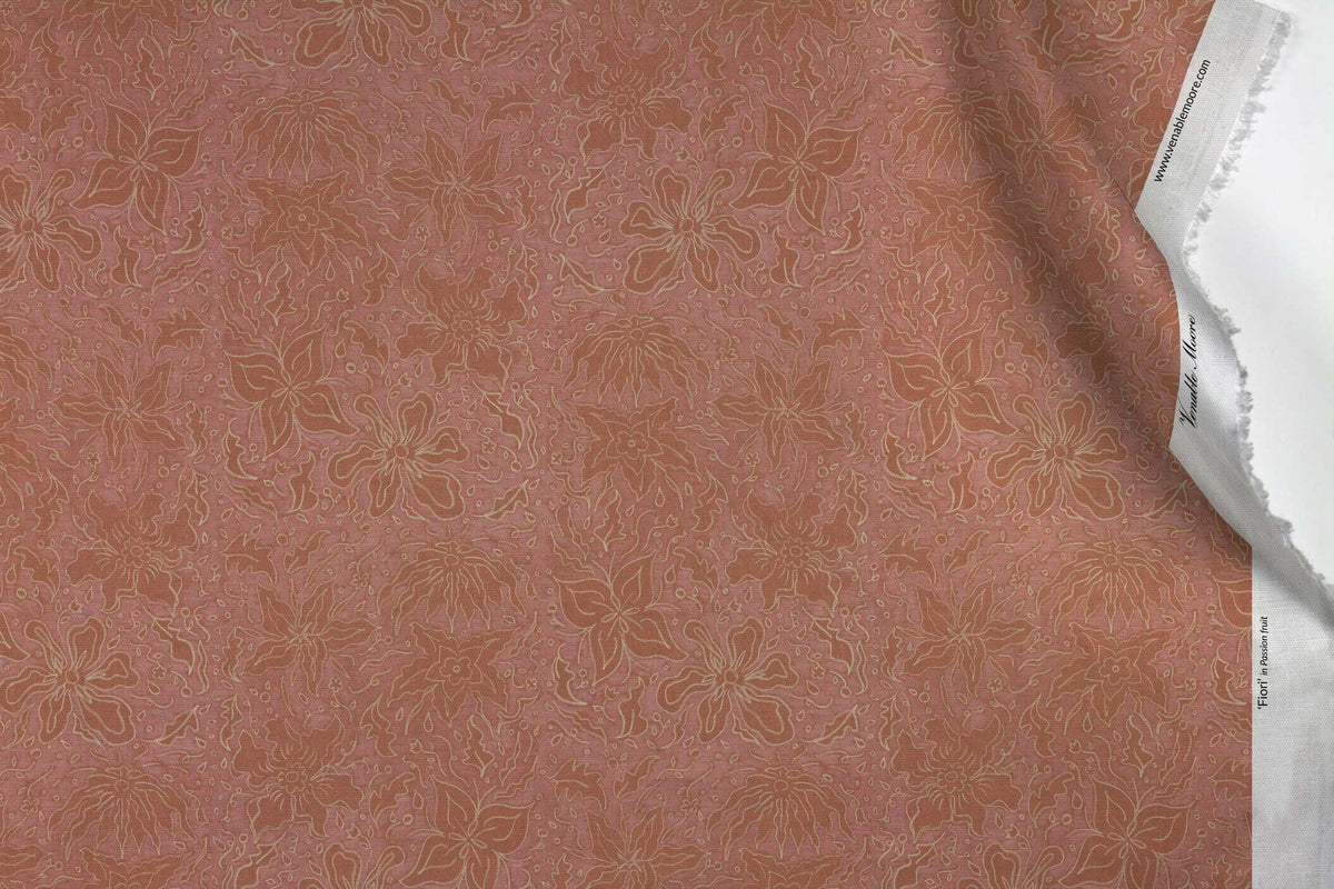 Venable Moore 100% Cotton Fiori hand drawn floral fabric by the yard in passion fruit pink with top fold against white