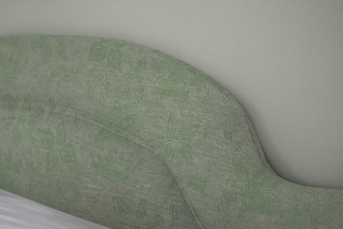 Fiori hand drawn floral cotton fabric in seafoam green upholstered on a headboard and installed in a bedroom