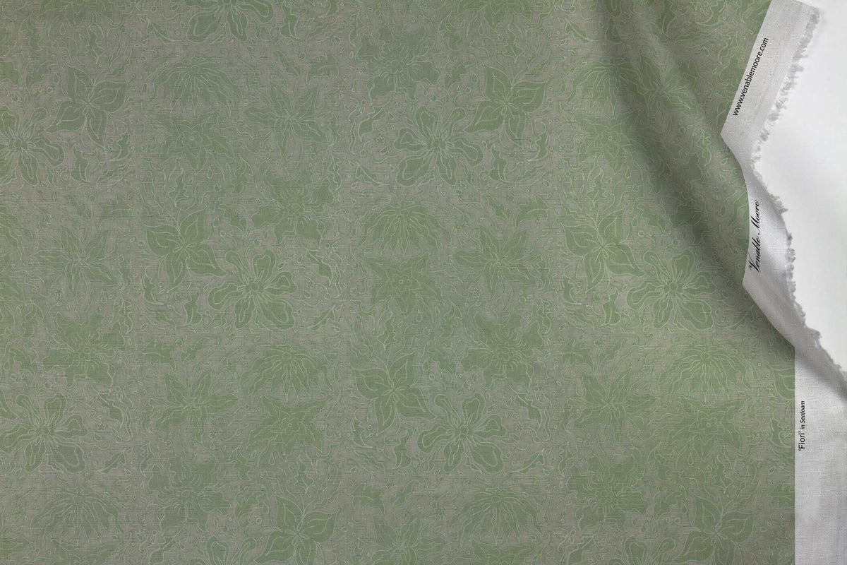 Venable Moore 100% Cotton Fiori hand drawn floral fabric by the yard in seafoam green with top fold against white