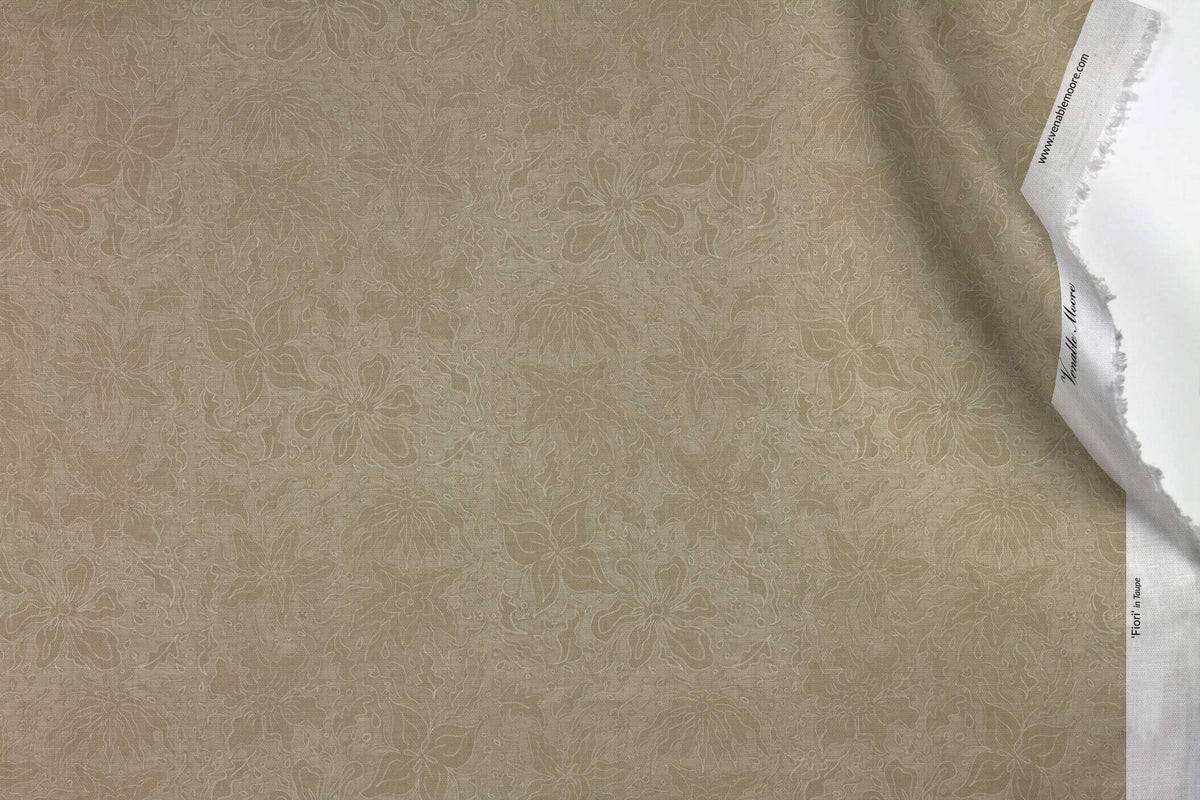 Venable Moore 100% Cotton Fiori hand drawn floral fabric by the yard in neutral taupe with top fold against white