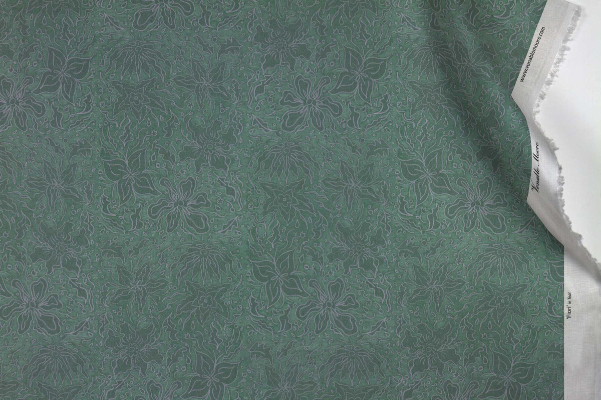 Venable Moore 100% Cotton Fiori hand drawn floral fabric by the yard in teal green with top fold against white