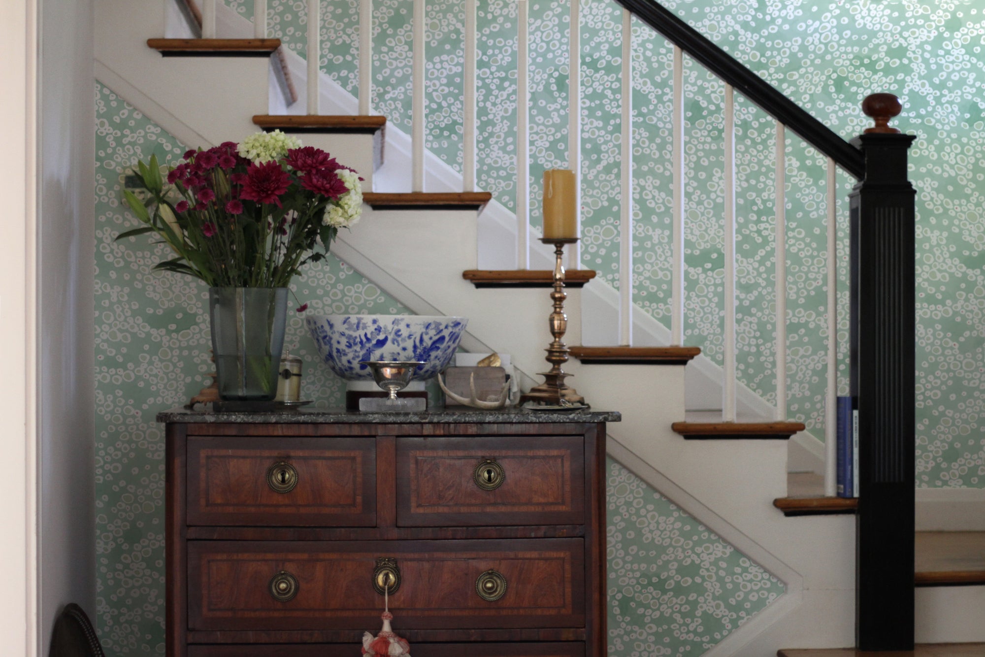 Frizzante hand-painted wallpaper in Verdigris installed in entry way