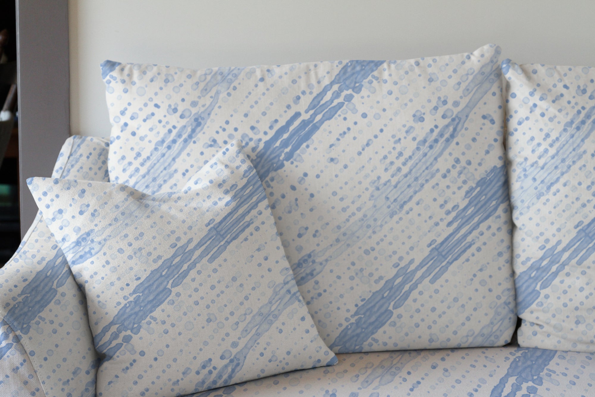 hand-dyed Glissando Shibori linen in powder blue by Venable Moore upholstered on a sofa