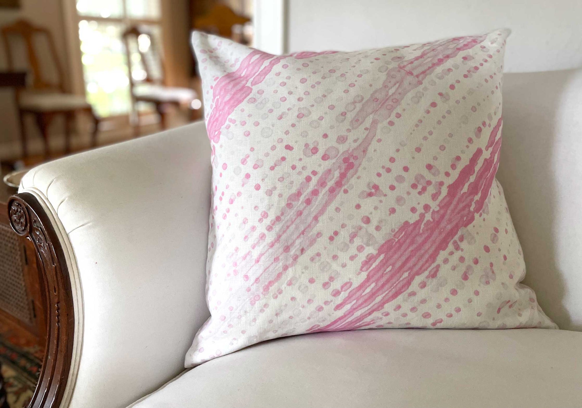 Glissando shibori linen pillow in posy by Venable Moore on a white sofa