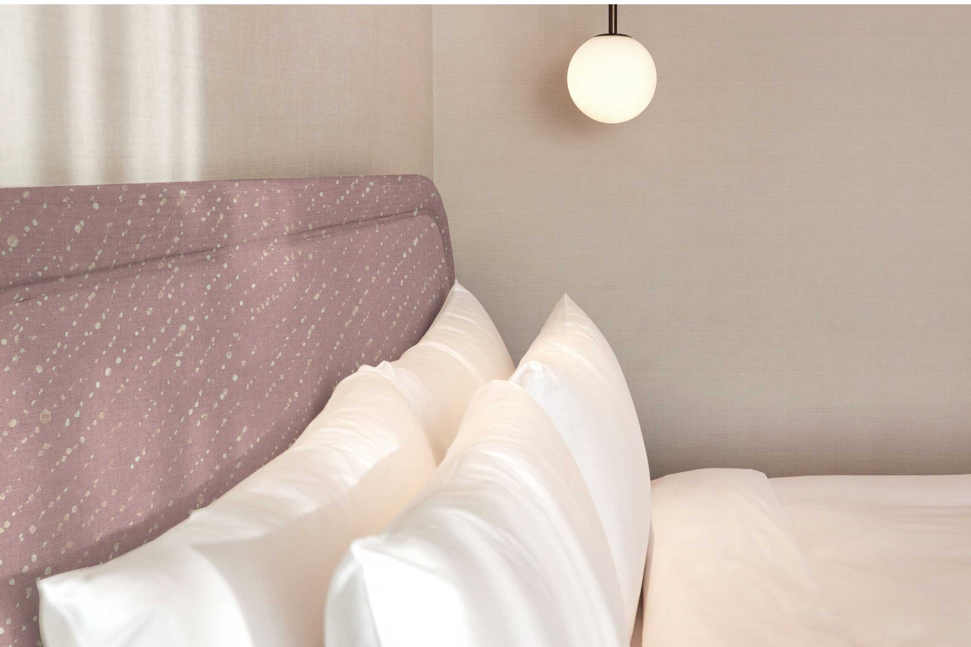 Venable Moore Staccato Decolorato Shibori in Rose Clay linen upholstered on a headboard in a bedroom