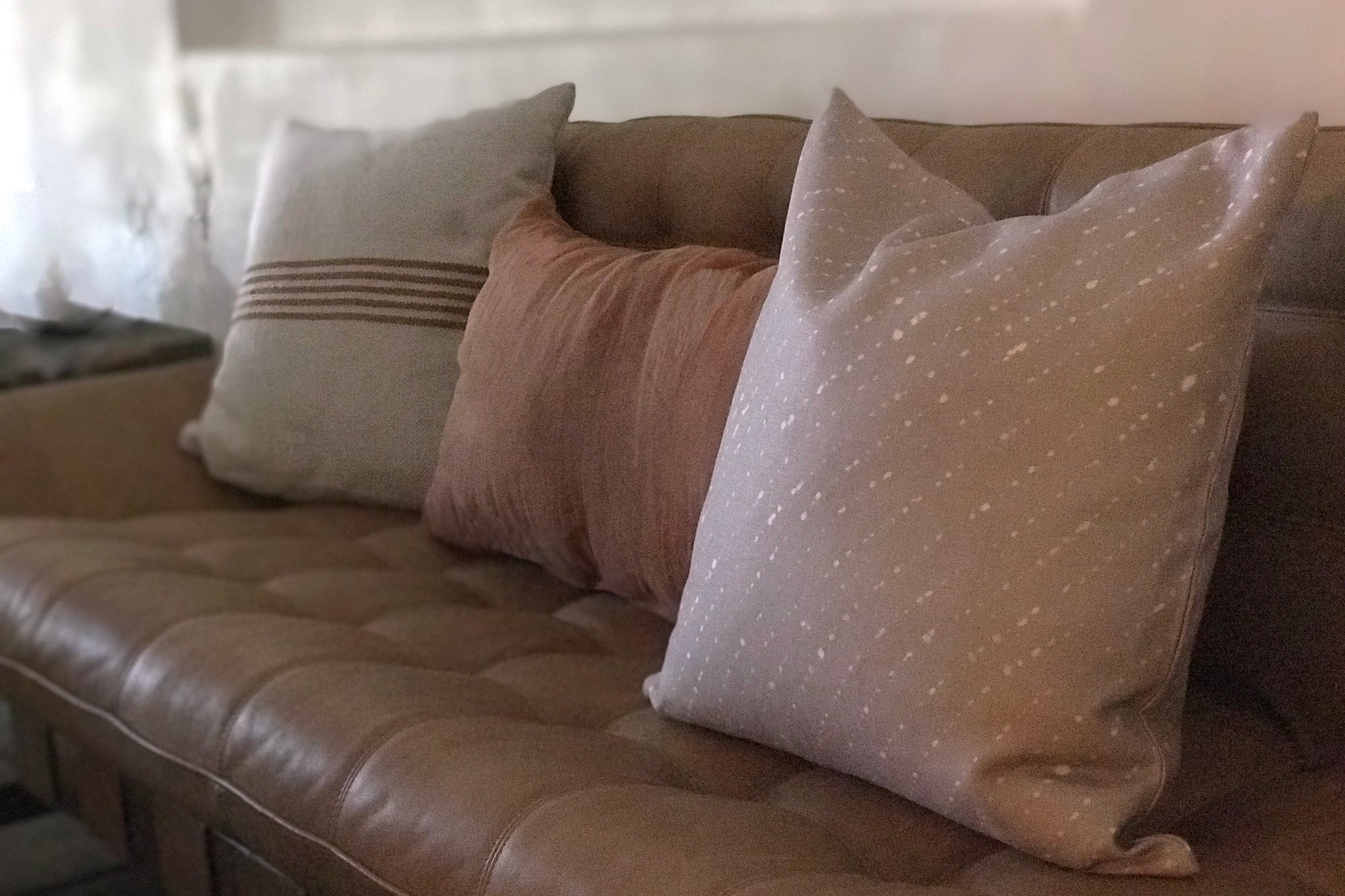 Staccato Sbiancato Shibori linen pillow in flax on Lawson Fenning sofa