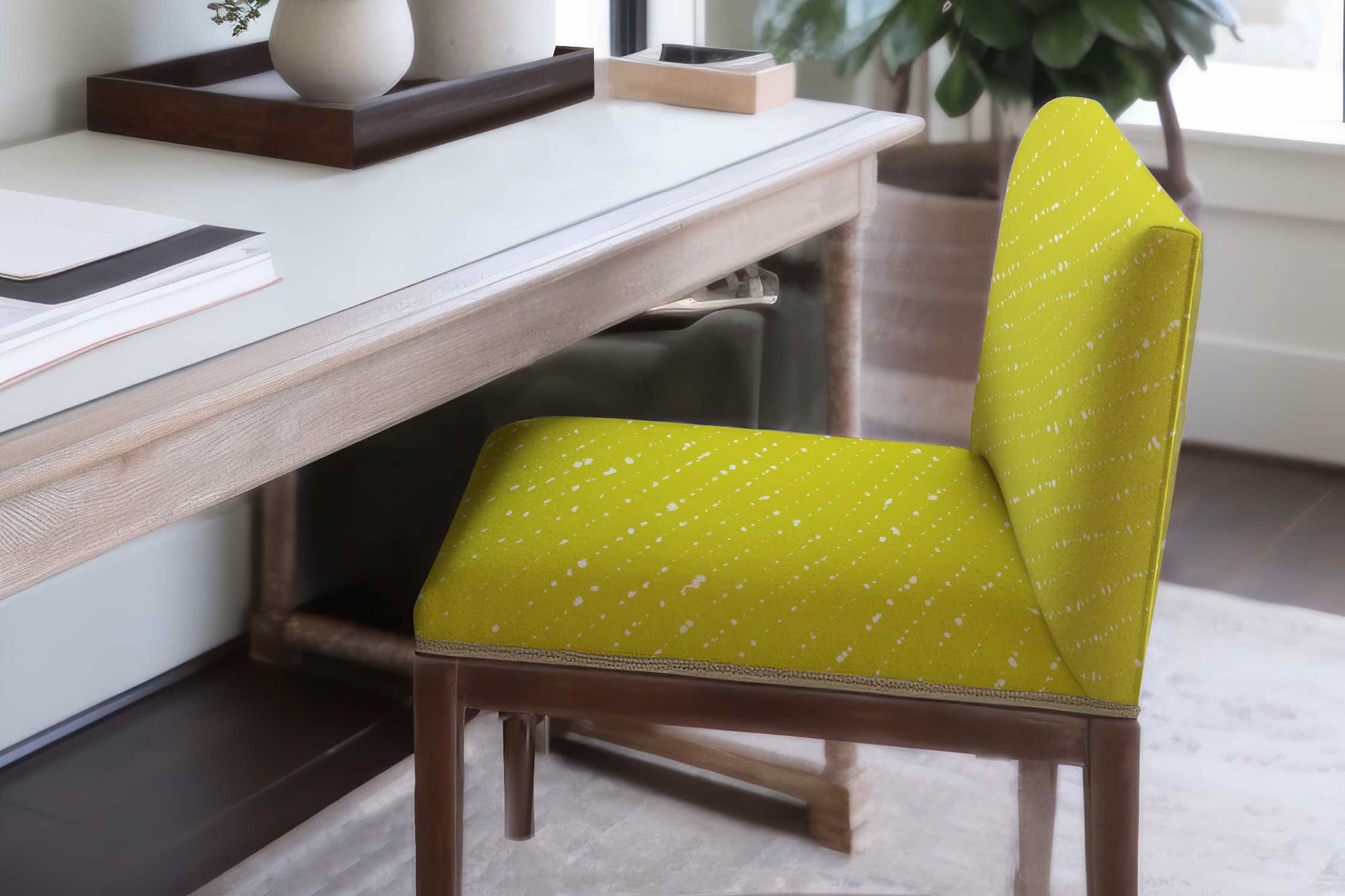Staccato Sbiancato Shibori linen in pear on an upholstered chair in a office