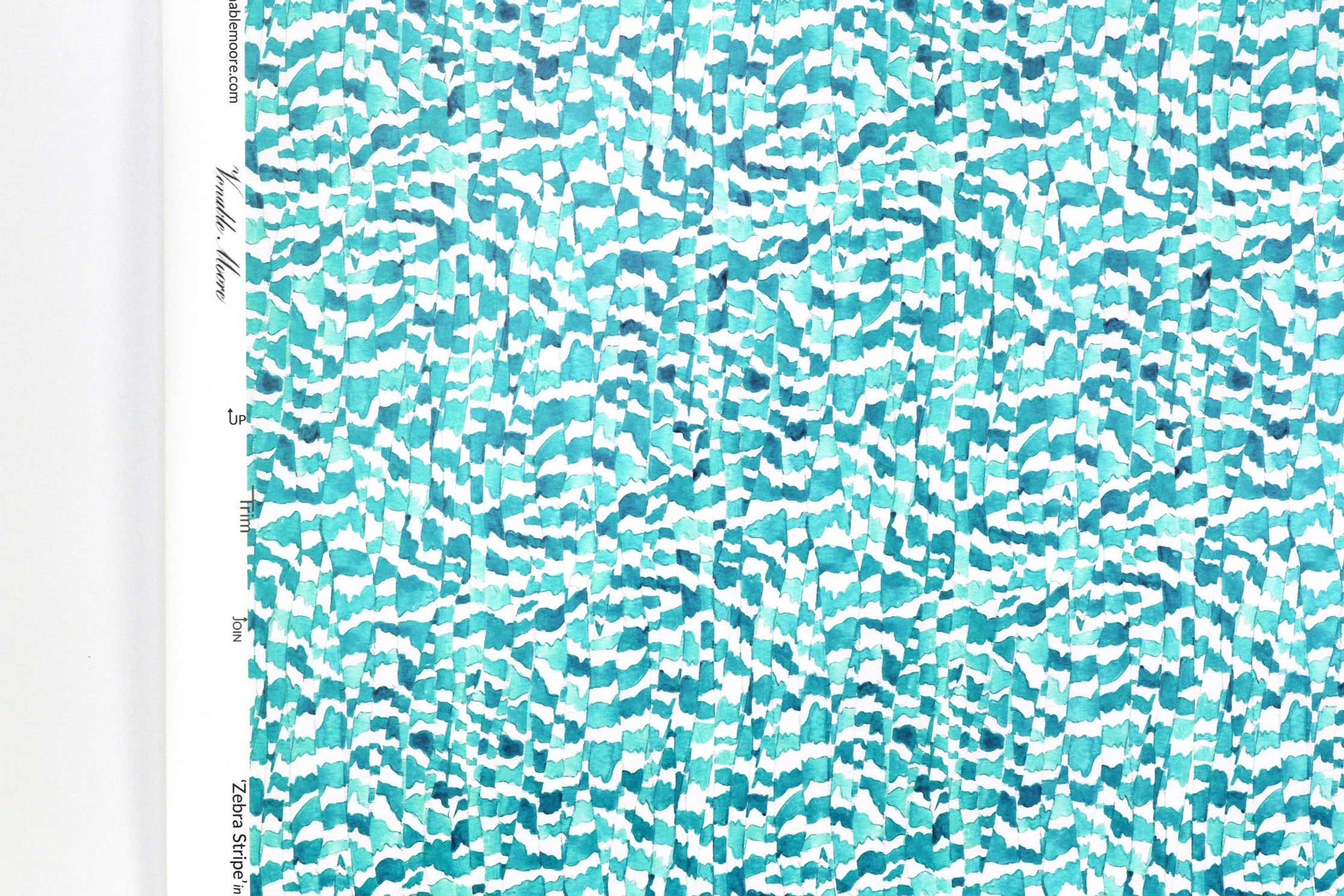 Up close view of Venable Moore Zebra Stripe abstract animal in turquoise blue FSC Certified Clay Coated wallpaper roll against a white wall