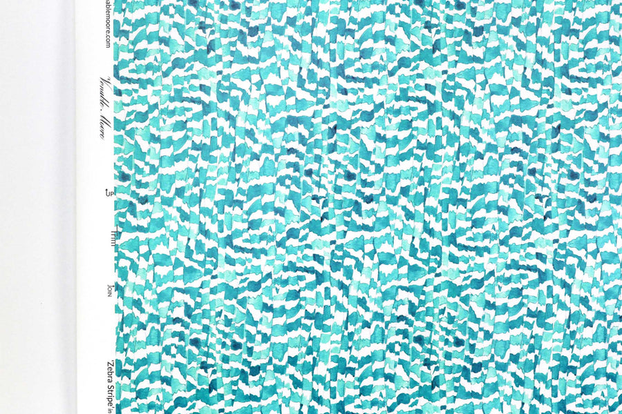 Up close view of Venable Moore Zebra Stripe abstract animal in turquoise blue FSC Certified Clay Coated wallpaper roll against a white wall