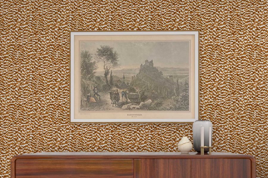 Venable Moore Zebra Stripe abstract animal in chestnut brown made-to-order, printed in the U.S.A. wallpaper on a wall with wood console, vases, and framed art