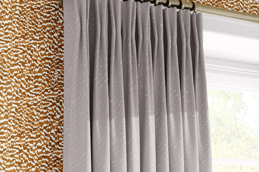 Venable Moore Zebra Stripe abstract animal in chestnut brown made-to-order, printed in the U.S.A. wallpaper on a wall with 100% European linen “Staccato Sbiancato’ Shibori curtains in natural flax and window 