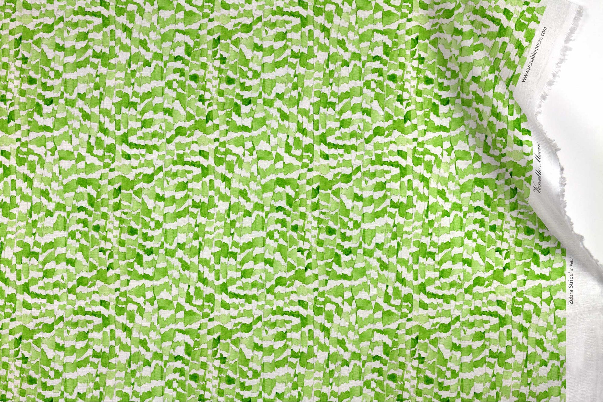 Venable Moore 100% European linen Zebra Stripe abstract animal fabric by the yard in petal green with top fold against white