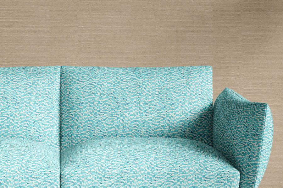 sofa upholstered in venable moore 100% European linen Zebra Stripe abstract animal fabric in turquoise blue, made-to-order and sustainably printed in the U.S.A.