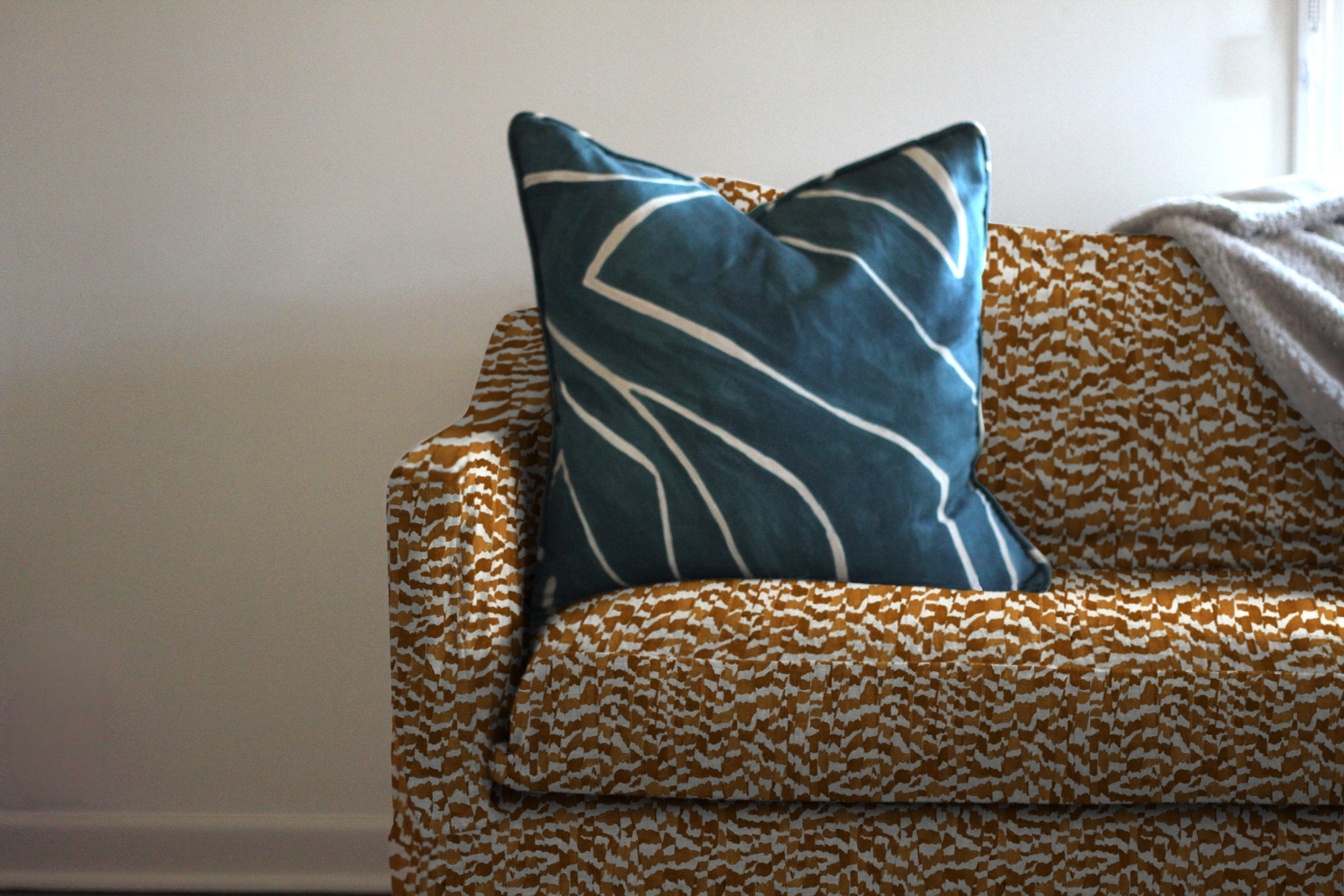 Zebra Stripe Animal print linen in Chestnut installed on a sofa