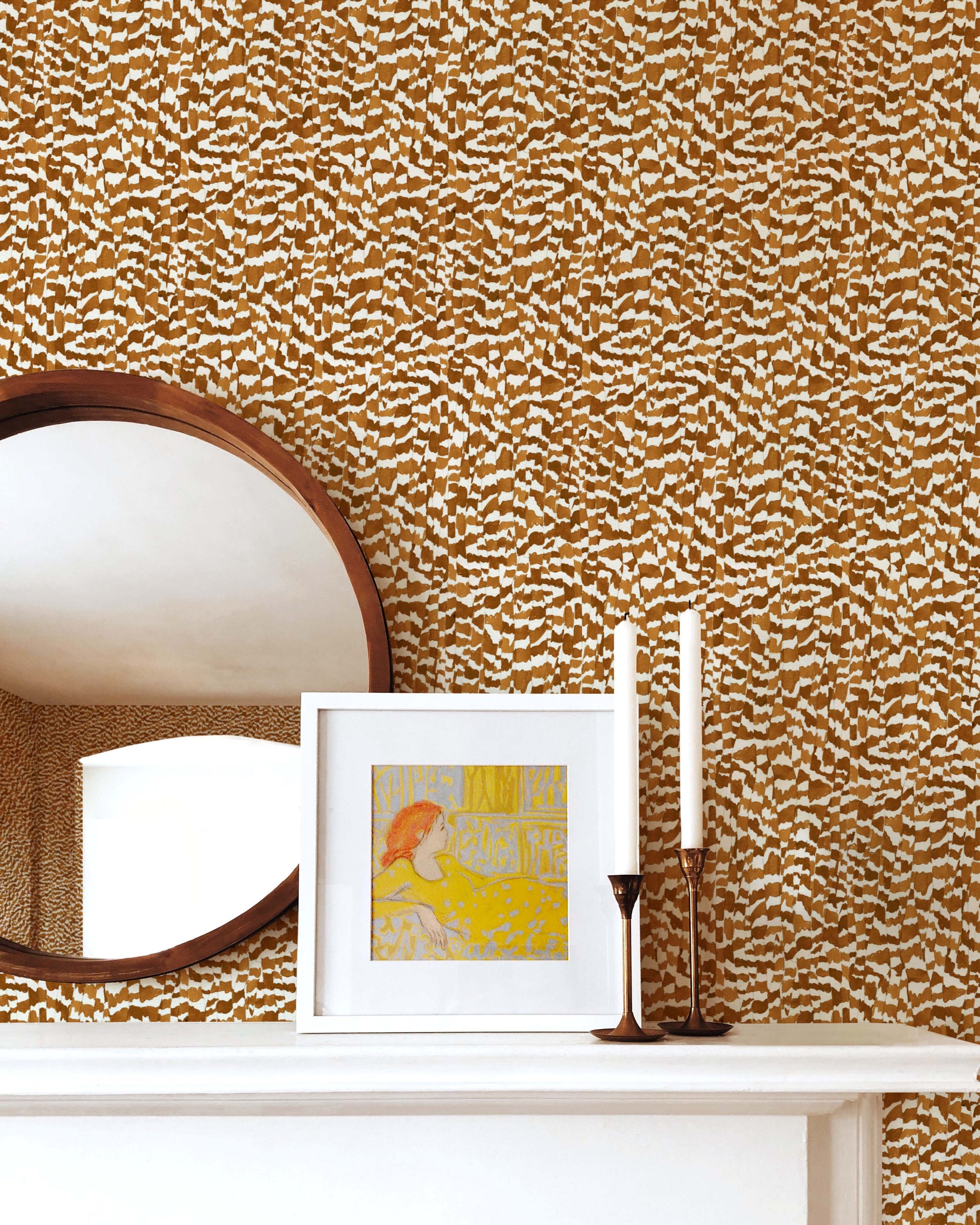Zebra Stripe abstract animal wallpaper in chestnut installed above a mantle with mirror, picture, and candles