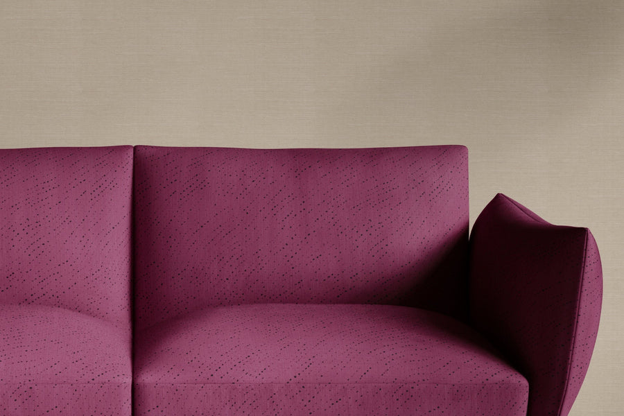 sofa upholstered in 100% linen staccato nero shibori fabric in cerise pink