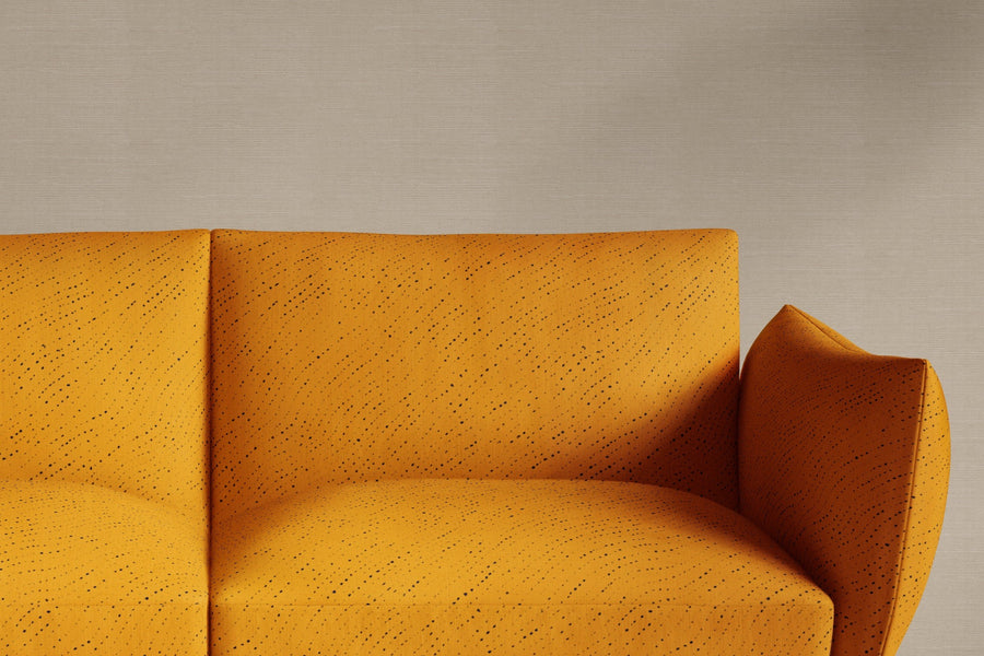 sofa upholstered in 100% linen staccato nero shibori fabric in marigold yellow