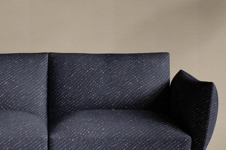 sofa upholstered in 100% linen staccato decolorato shibori fabric in midnight blue
