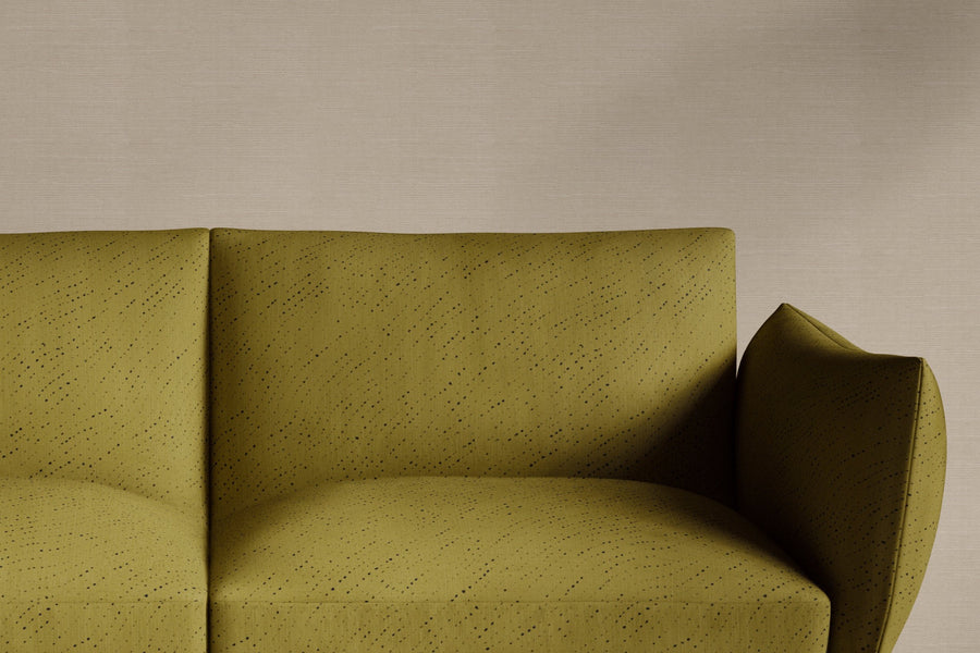 sofa upholstered in 100% linen staccato nero shibori fabric in moss green