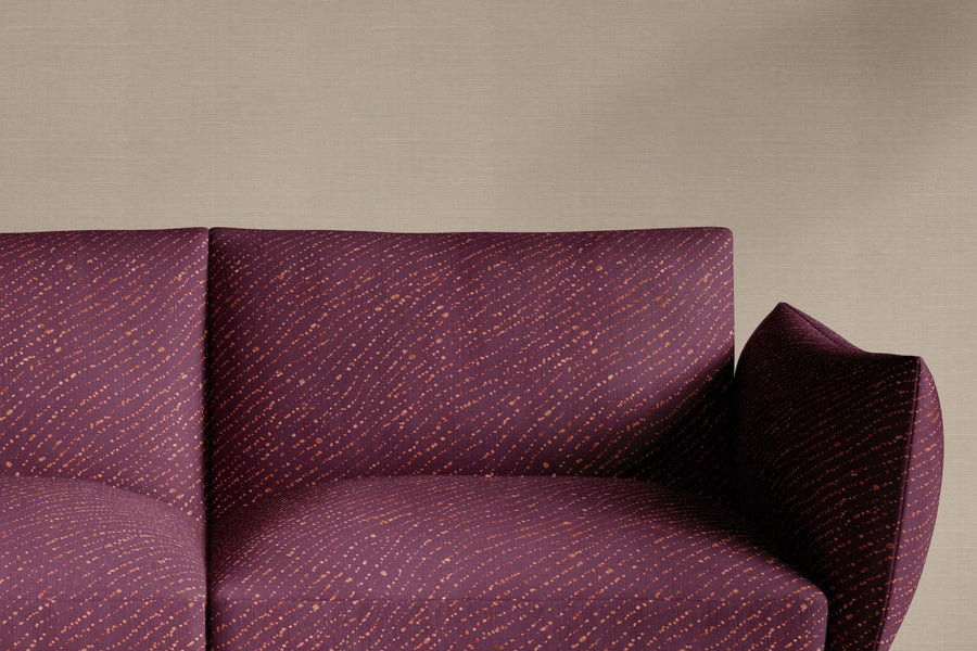 sofa upholstered in 100% linen staccato decolorato shibori fabric in plum purple