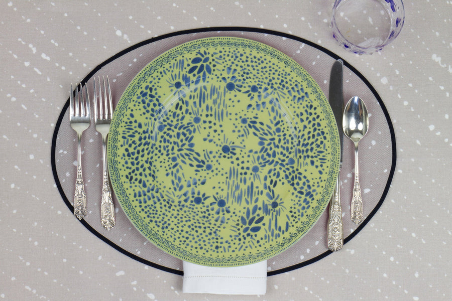 Venable Moore Mosaic Garden dinner plate in fresh apple green with hand-painted Bubble glass on neutral flax tan 'Staccato Sbiancato' Shibori linen placemat and tablecloth with silverware and white linen napkin