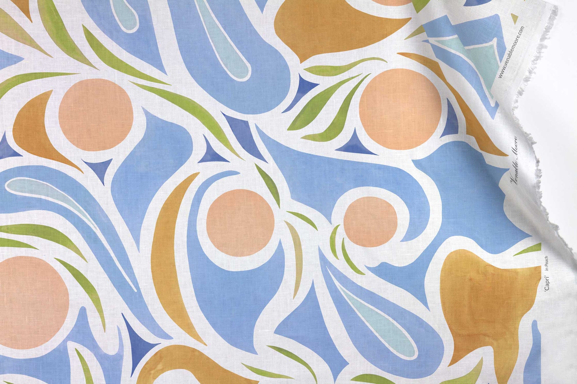 Venable Moore 100% European French linen Capri fabric by the yard in pastel pink, blue, and tan with top fold against white