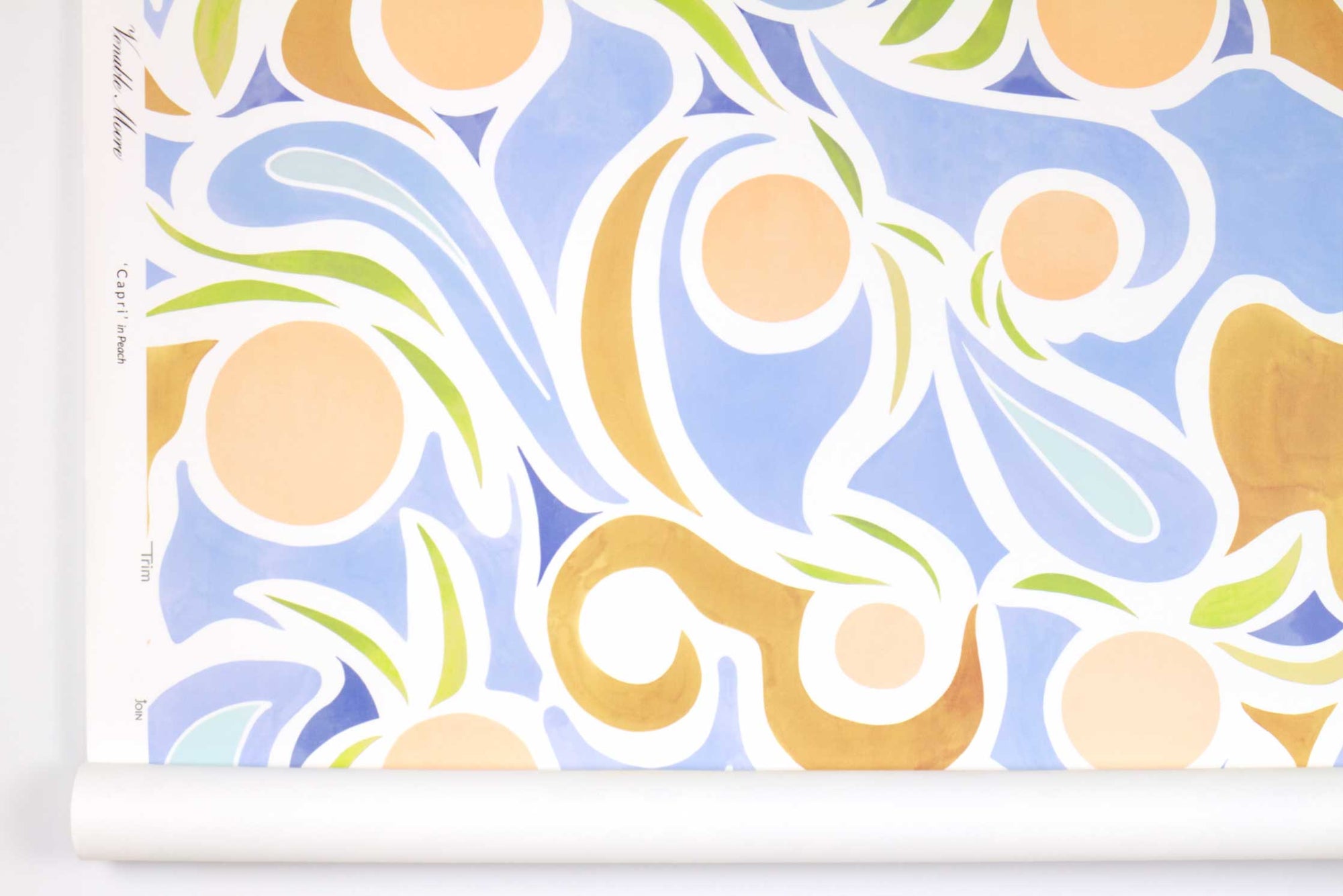 Venable Moore ‘Capri’ Pastel Peach Pink, Blue, and Tan boutique made-to-order, printed in the U.S.A. wallpaper roll against white wall